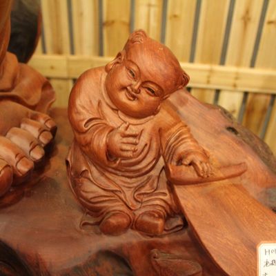 巨型花梨根雕九子弥勒佛像 艺术与信仰的恢弘交响